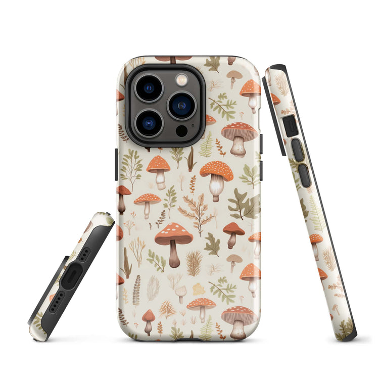 iPhone 14 Pro case featuring a charming pattern of various mushrooms in earthy tones on an off-white background. The design provides a full wrap-around view with precise cut-outs for the camera and side buttons.
