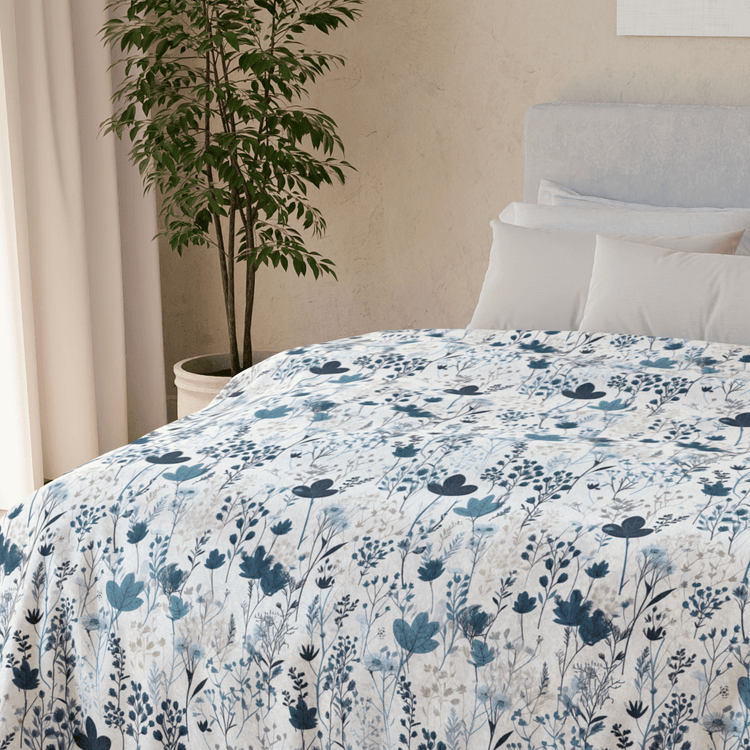 Serene Blue Wildflower design on a comfortable bed throw.